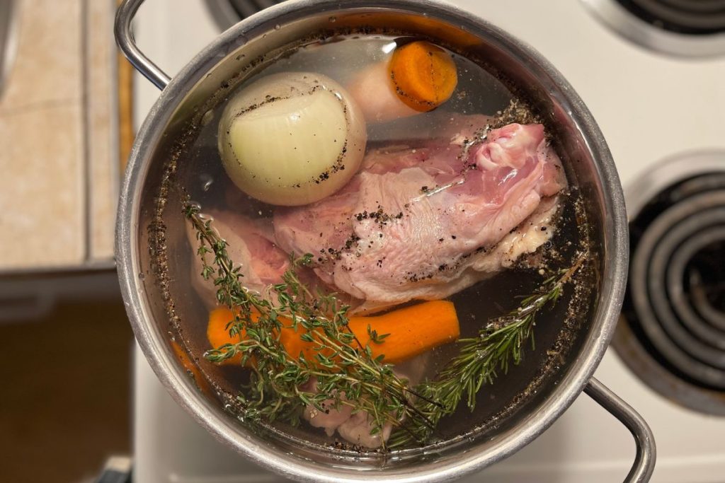 homemade chicken broth on the stove